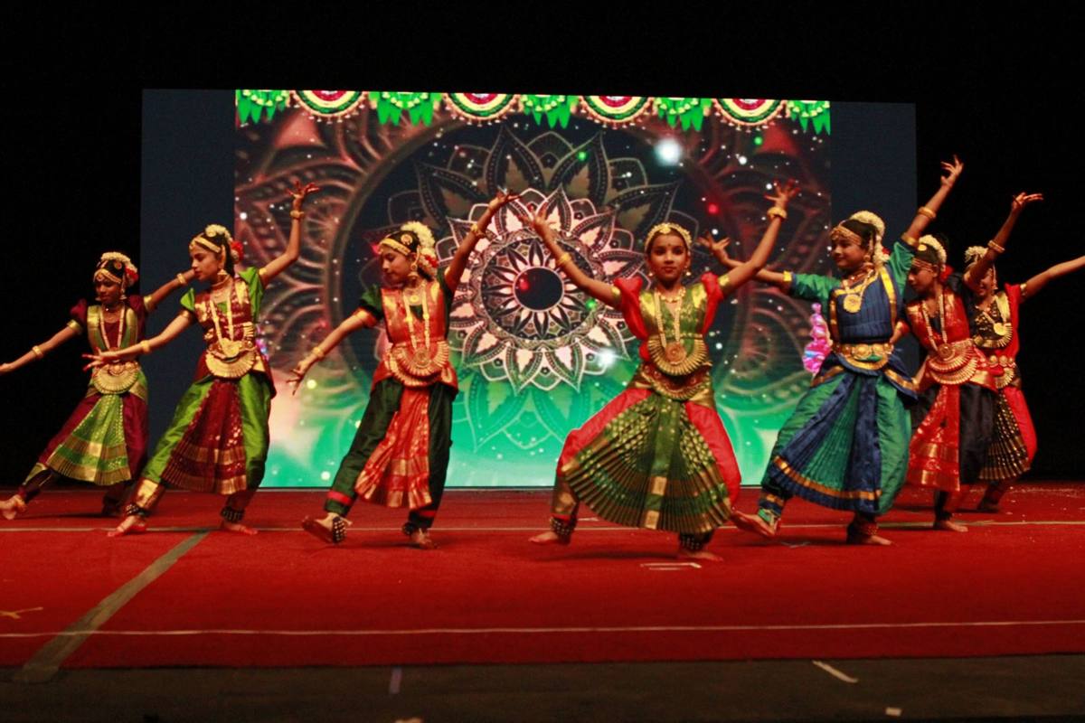 Greenwood students performing a classical Indian dance on stage